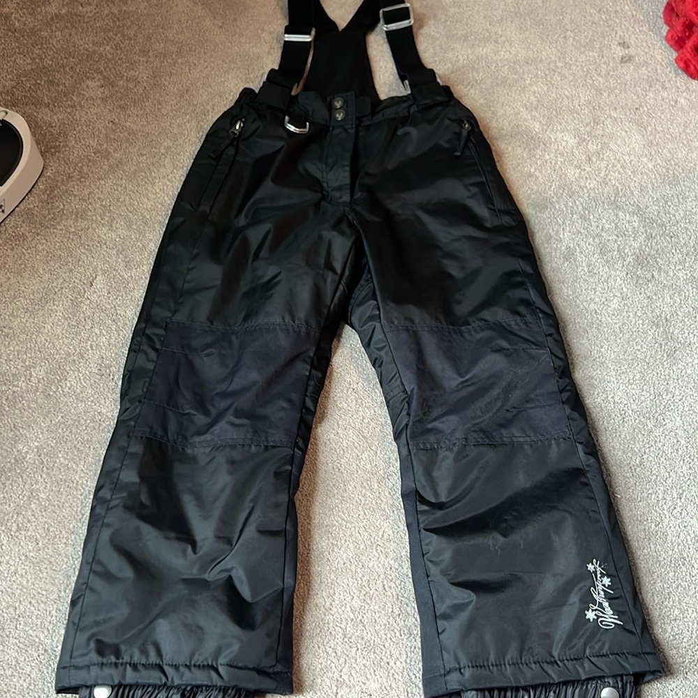 Snow pants with suspenders.